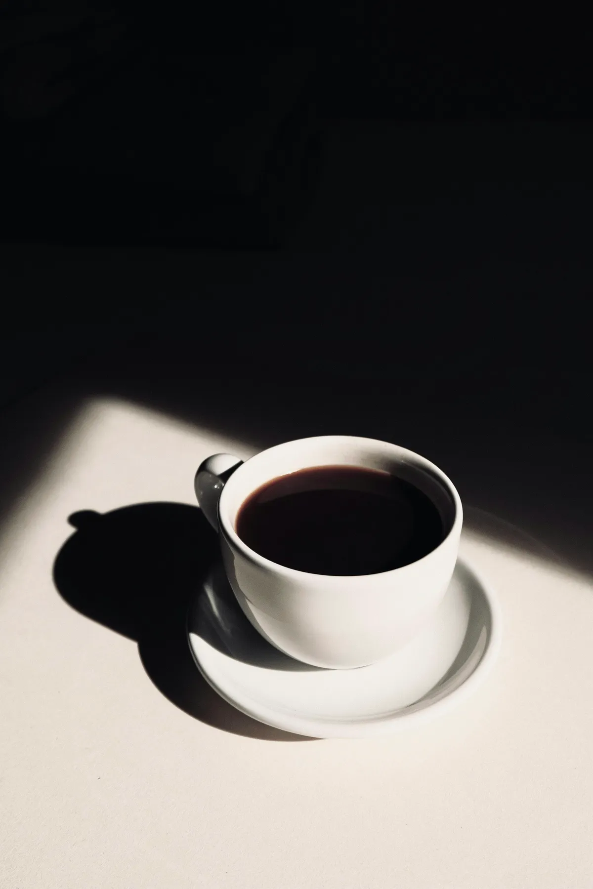 white ceramic teacup on saucer
